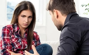 couple arguing in living room